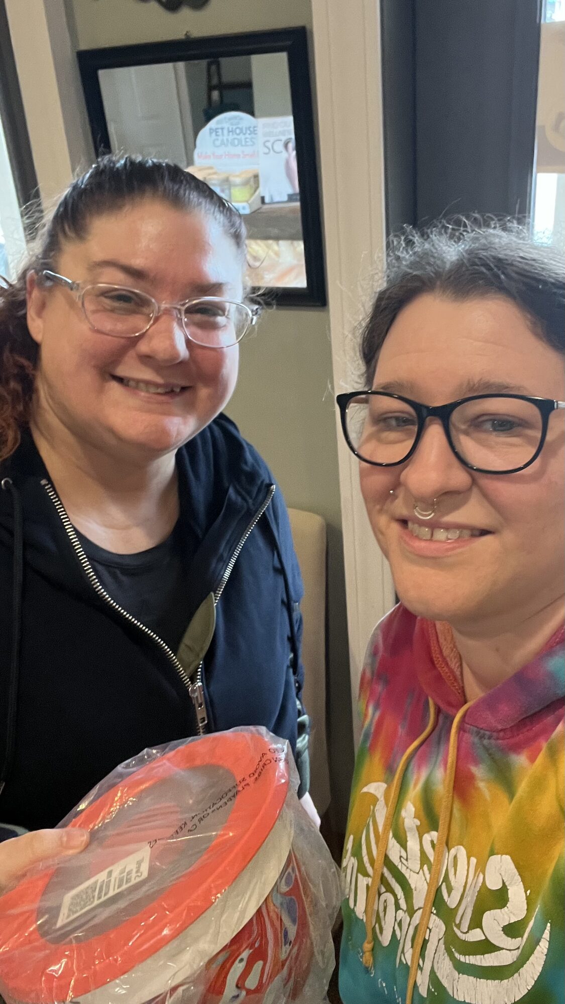 Two people smiling together during a visit